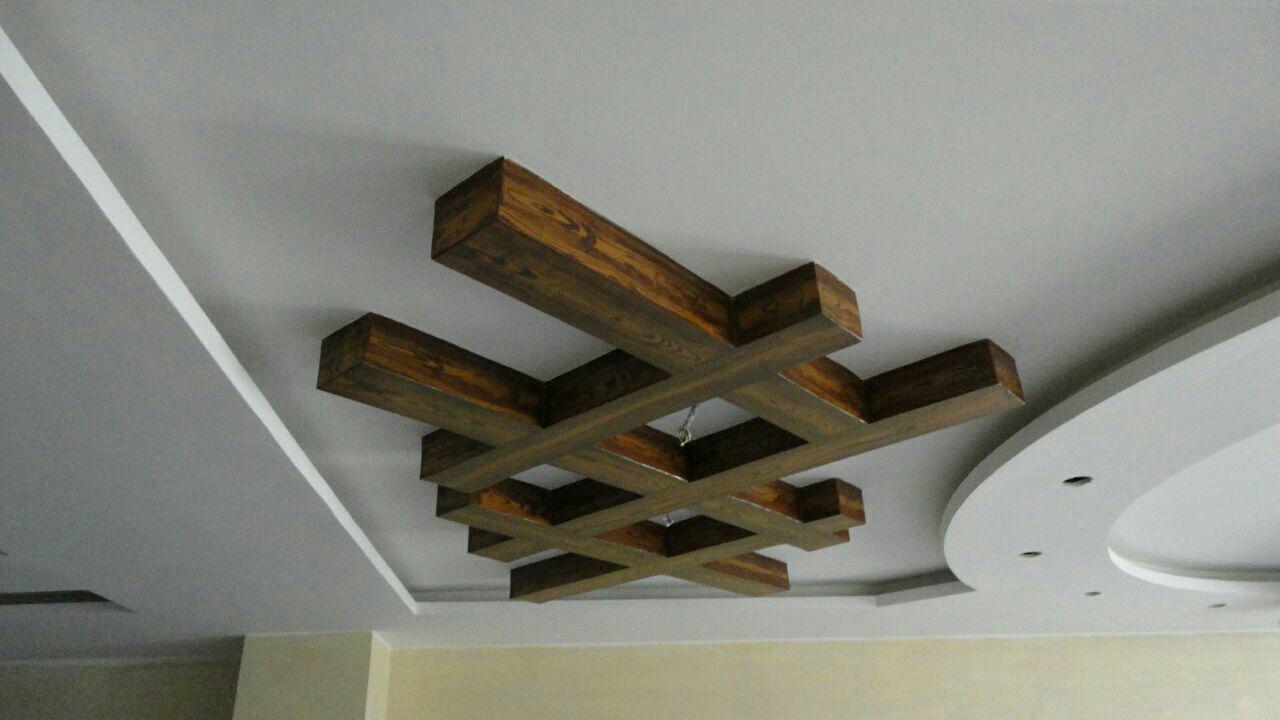 نمونه کار طرح چوب روی سقف دور لامپ